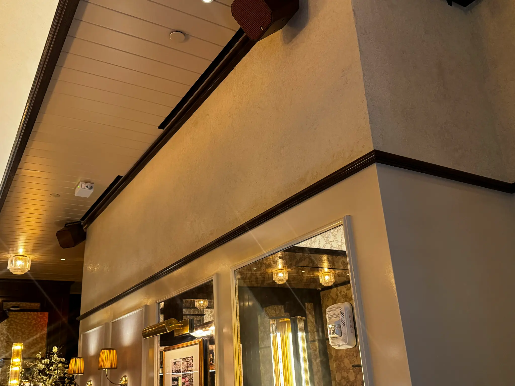 Carversteak NYC — plaster wall meeting a beadboard ceiling corner