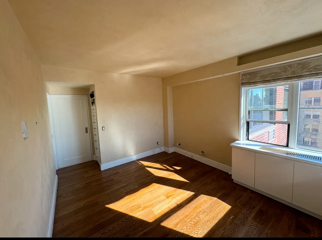 Horatio St. Apartment — bedroom with warm lime-plaster walls and ceiling