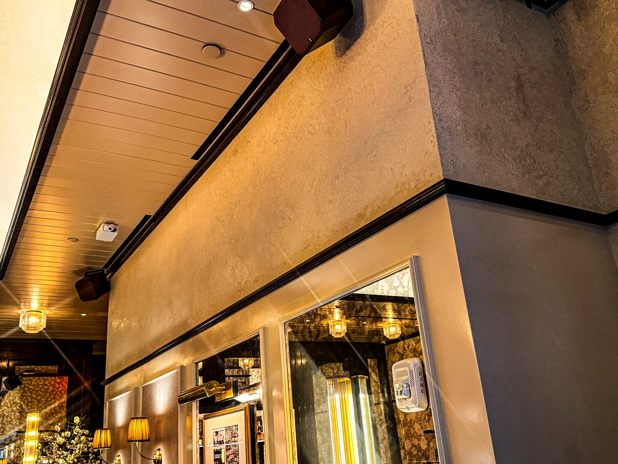 Carversteak NYC — polished plaster coffered ceiling above dark millwork