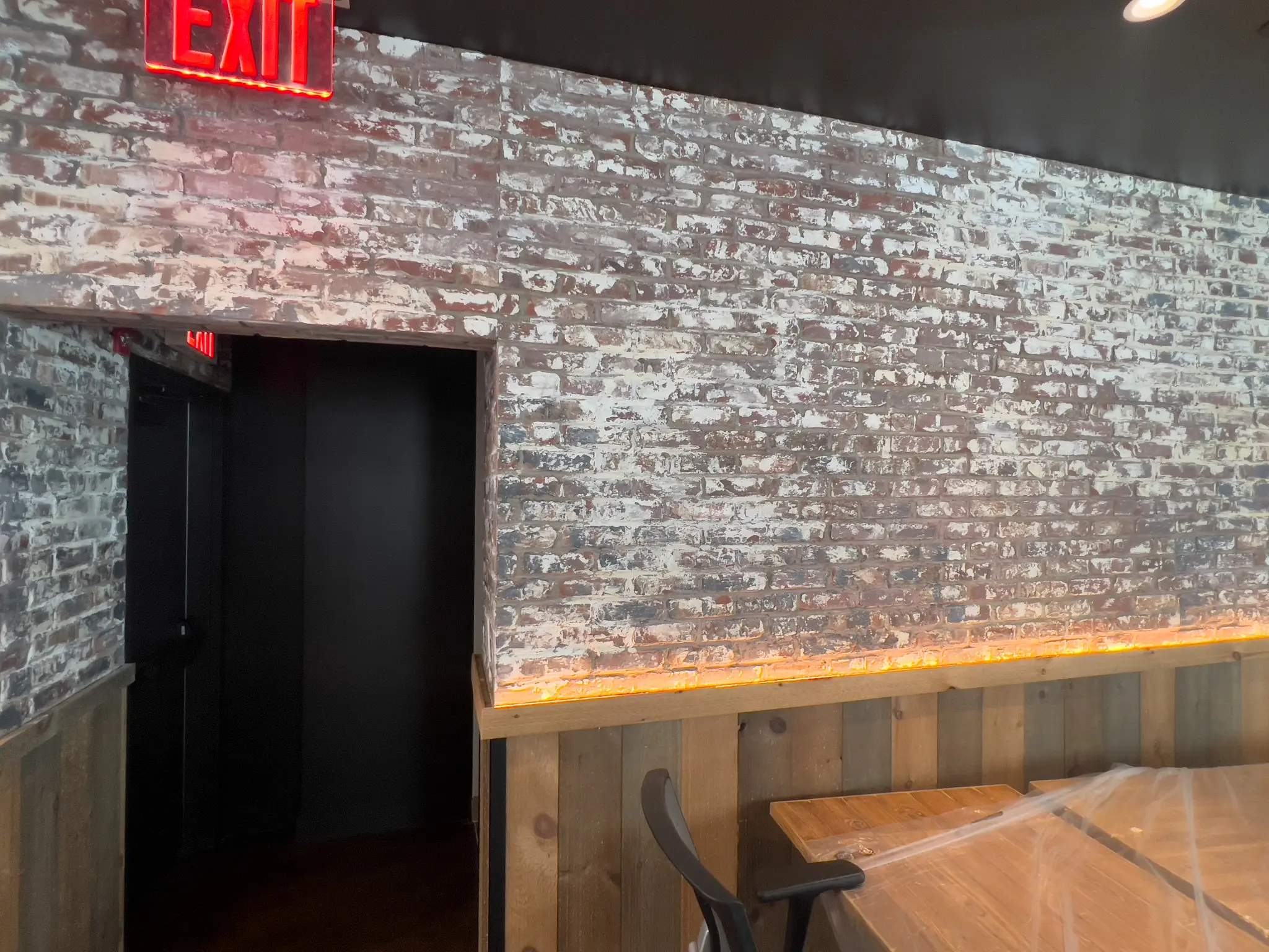 Forge — dining room doorway with faux-aged whitewashed brick finish