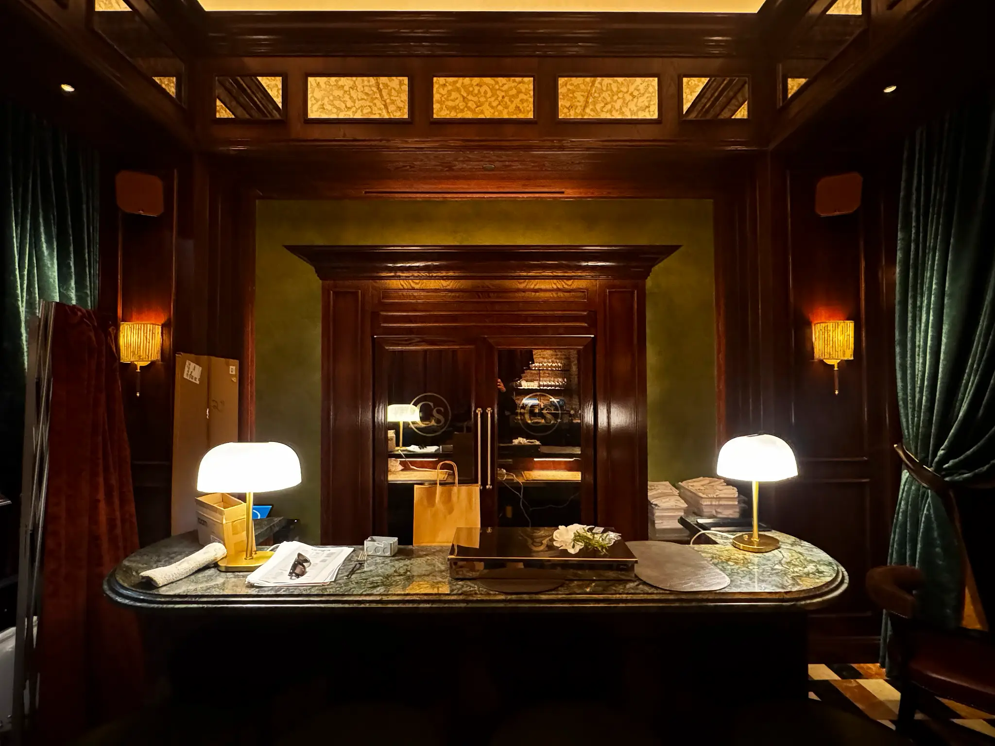 Carversteak NYC — plaster-paneled entry vestibule leading to etched-glass doors at the host stand