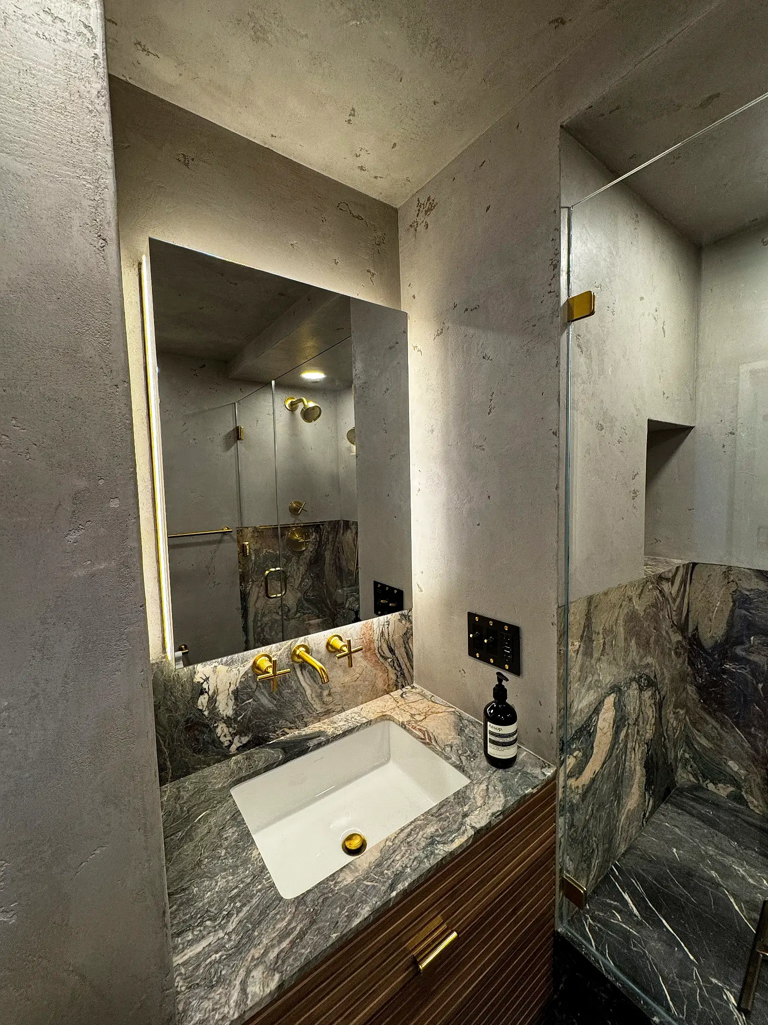 Horatio St. Apartment — primary bathroom vanity and mirror niche