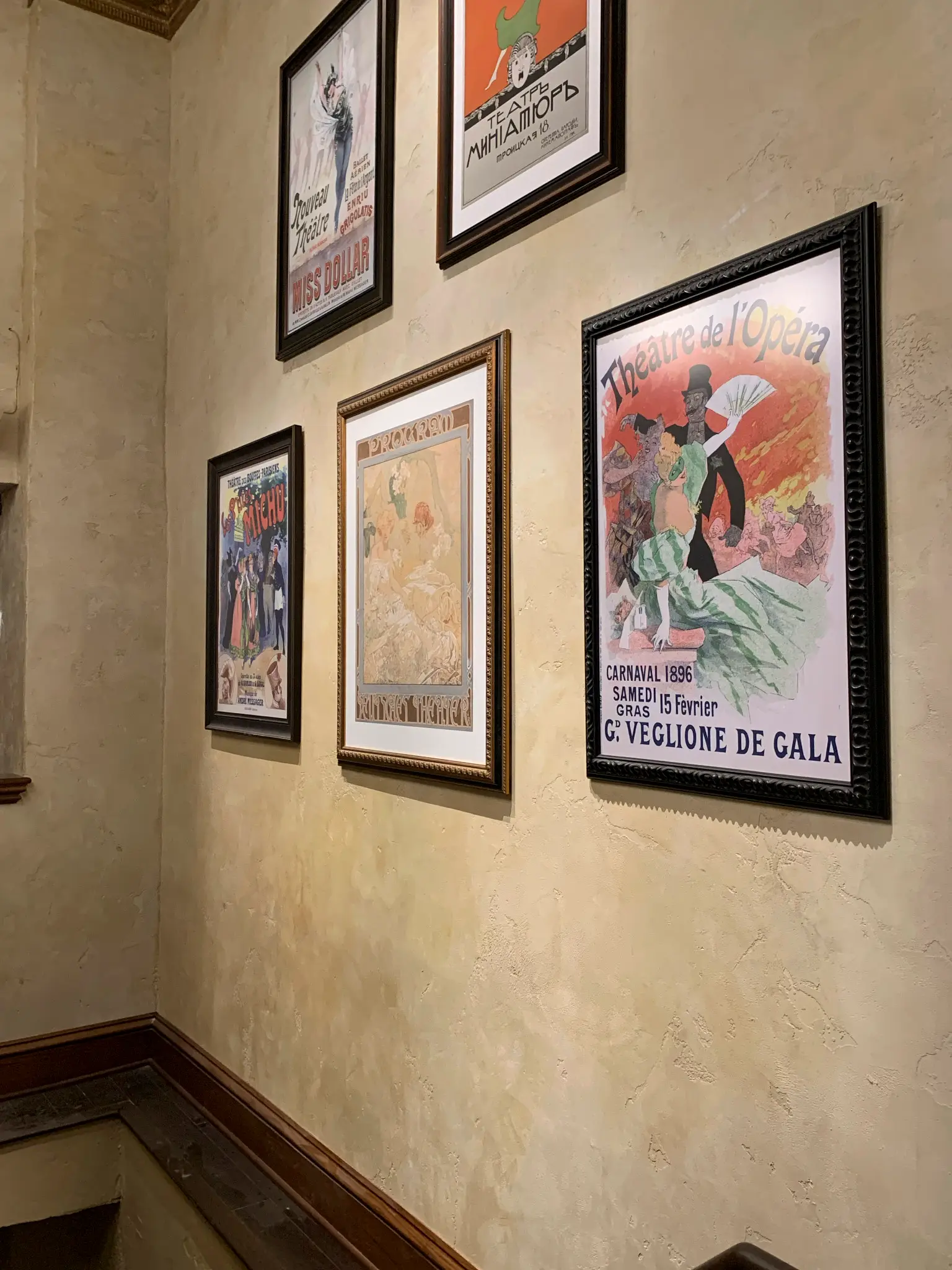 The Drama Book Shop — gallery wall of vintage theater posters over aged plaster