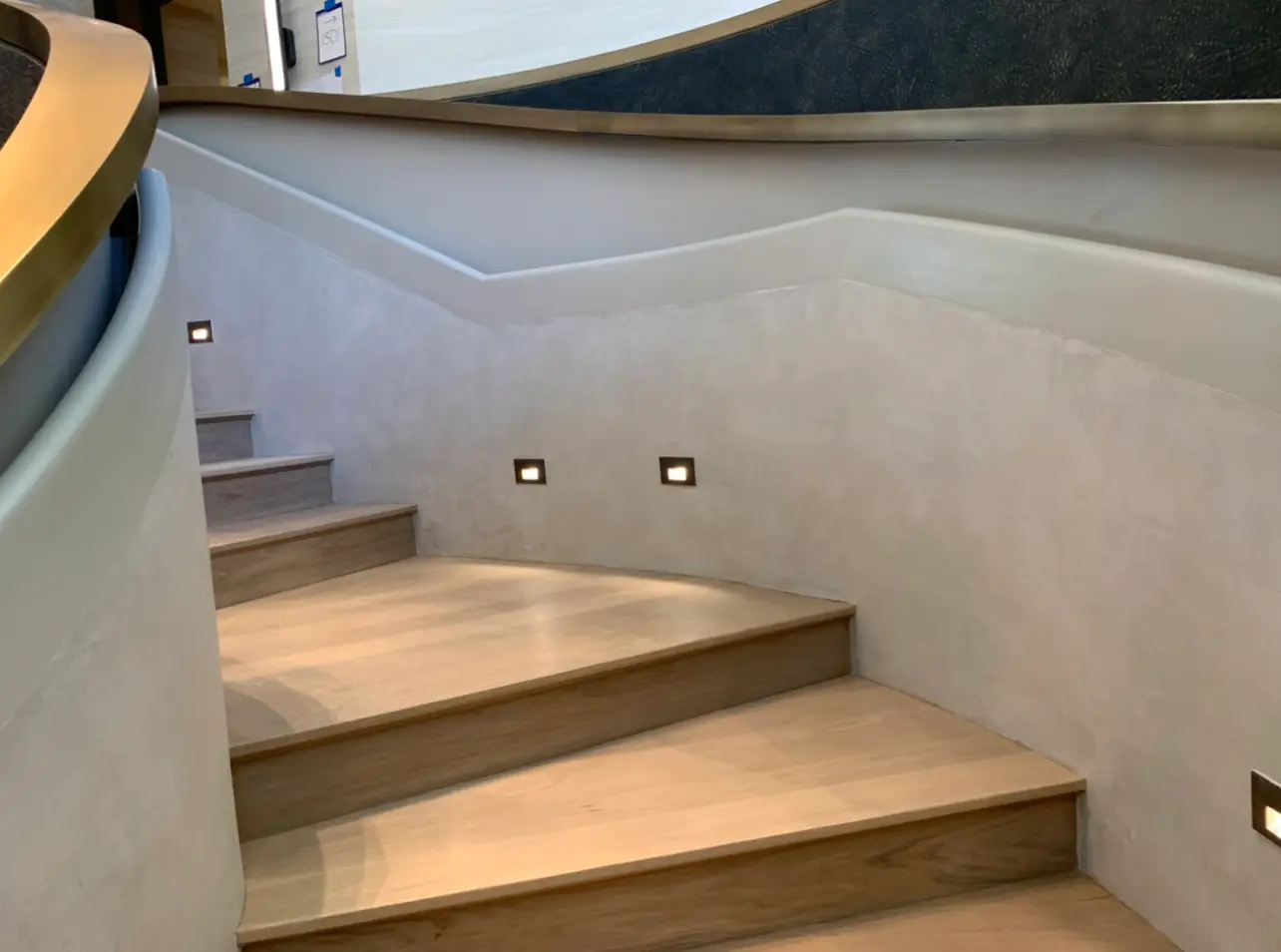 St. Regis Residences Rye — plaster stairwell wall along the lobby stair